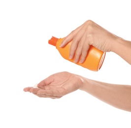 Woman with bottle of sun protection body cream on white background, closeup