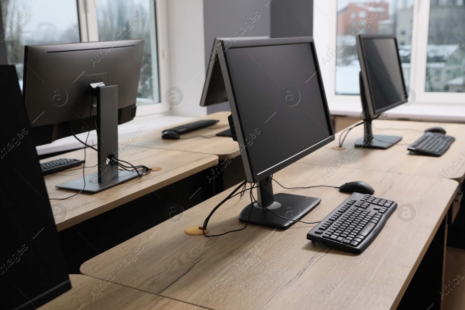 Photo of Many modern computers in open space office