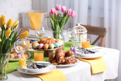 Festive Easter table setting with traditional meal at home