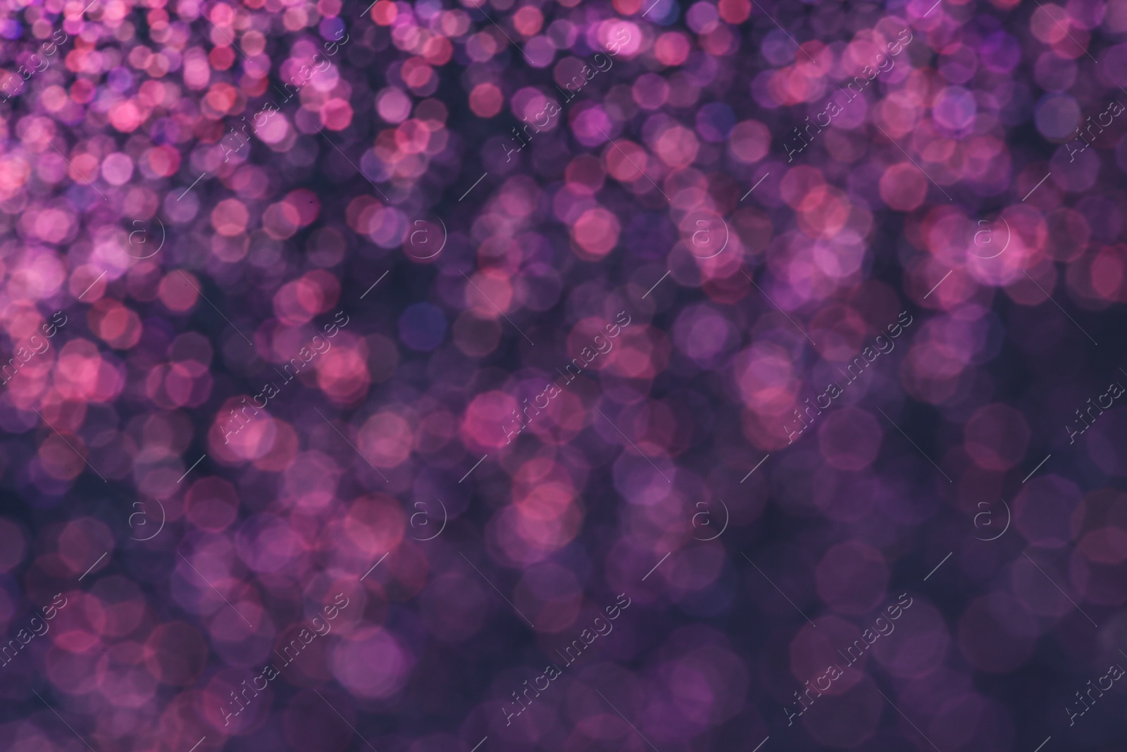 Photo of Magic pink bokeh effect on dark background