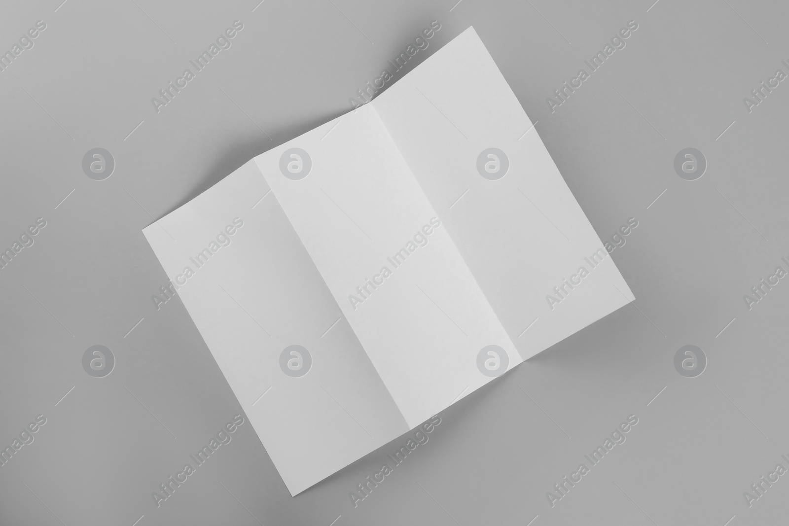 Photo of Blank paper brochure on light grey background, top view. Mockup for design