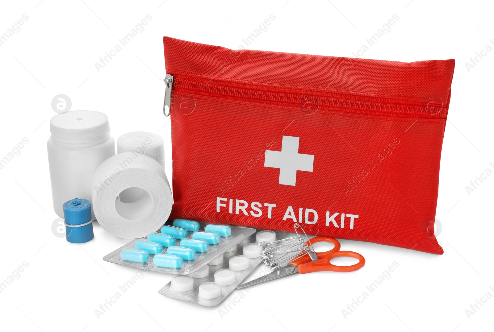 Photo of Red first aid kit, scissors, pins, pills, medical plaster and elastic bandage isolated on white