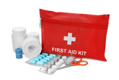 Photo of Red first aid kit, scissors, pins, pills, medical plaster and elastic bandage isolated on white