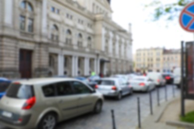 Photo of Blurred view of cars in traffic jam on city street