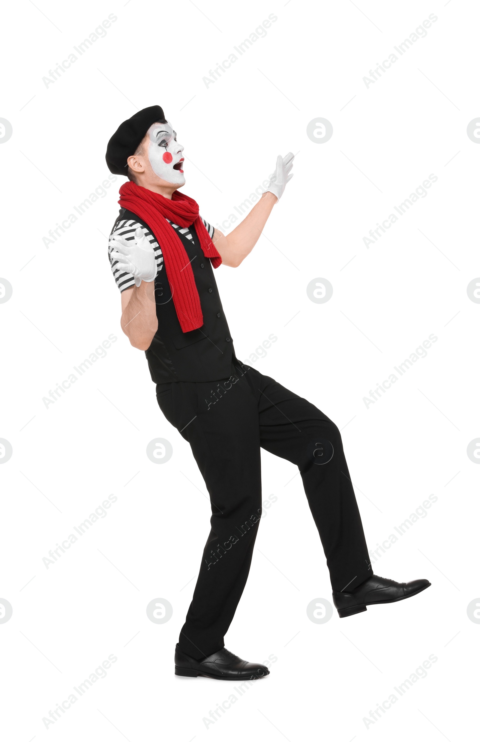 Photo of Funny mime artist making shocked face on white background