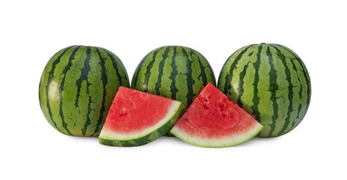 Photo of Delicious cut and whole ripe watermelons isolated on white