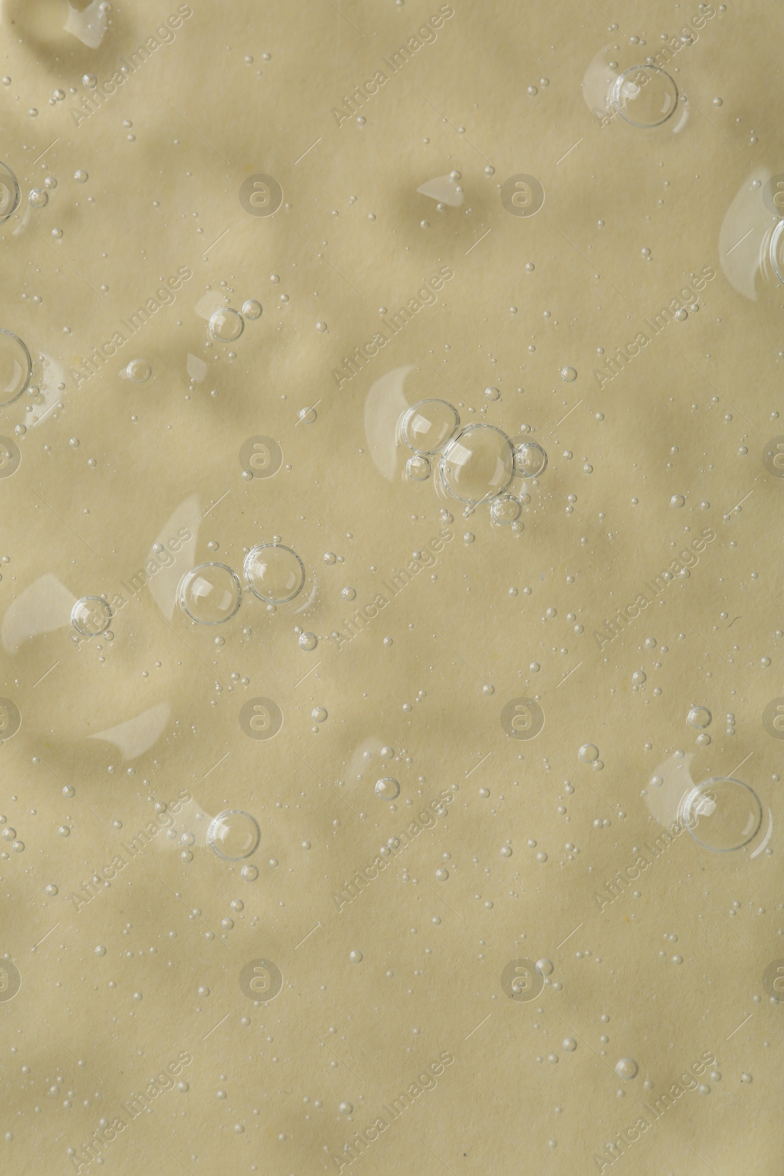 Photo of Cosmetic serum on beige background, top view