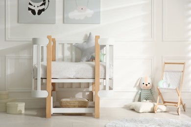 Photo of Baby room interior with stylish furniture and toys