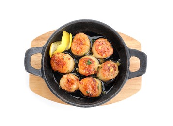 Photo of Delicious fried scallops in pan isolated on white, top view