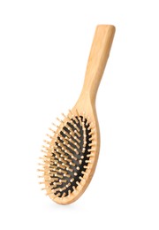 One new wooden hairbrush isolated on white