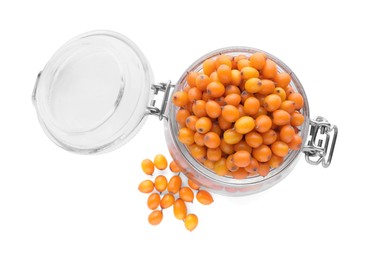 Glass jar with fresh ripe sea buckthorn berries on white background, top view