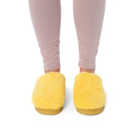 Woman in yellow soft slippers on white background, closeup