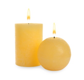 Photo of New wax candles on white background. Interior elements