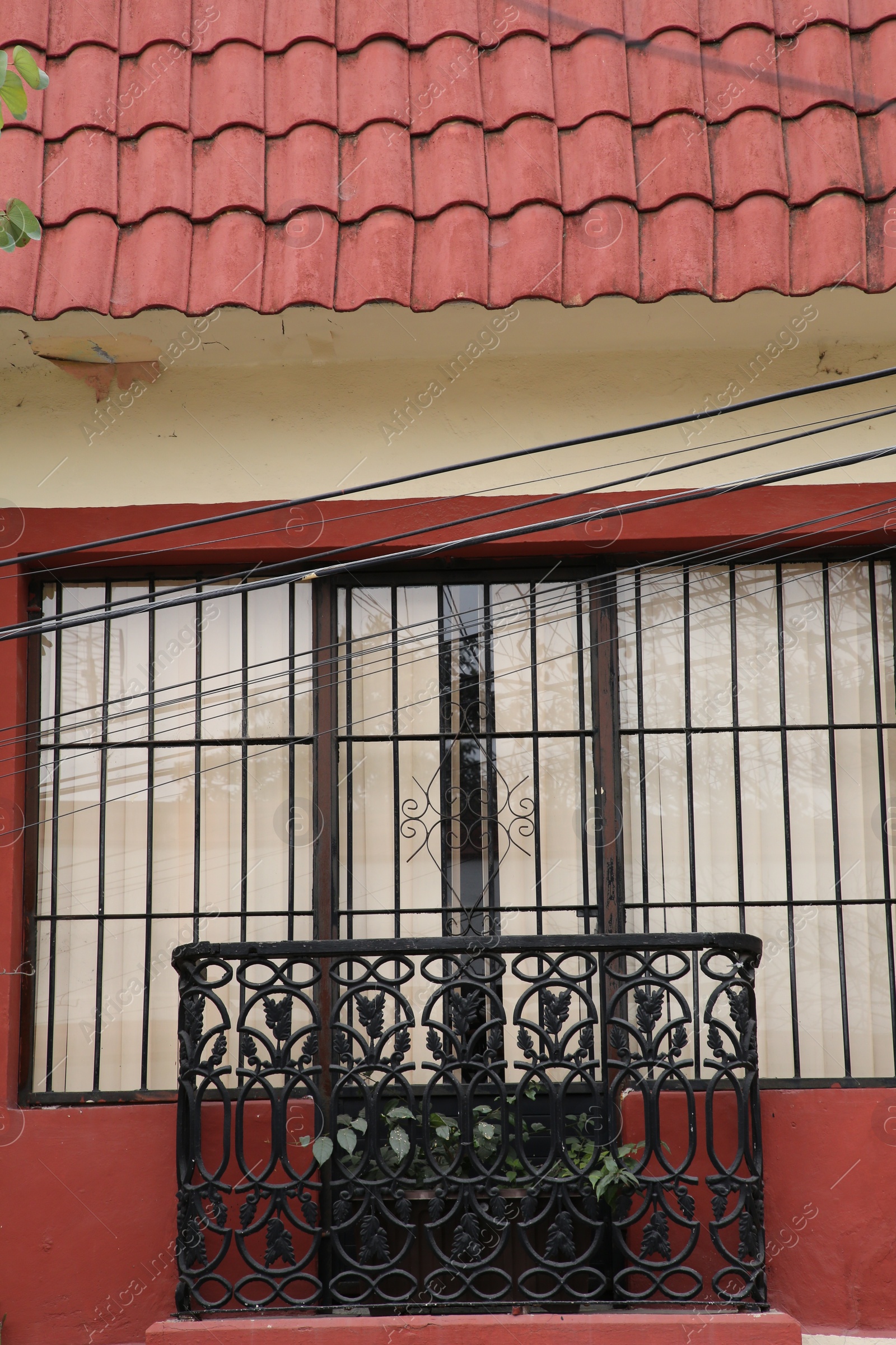 Photo of Facade of building with beautiful window and balcony