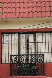 Facade of building with beautiful window and balcony