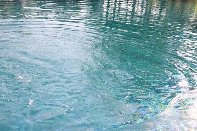 Clear rippled water in swimming pool outdoors