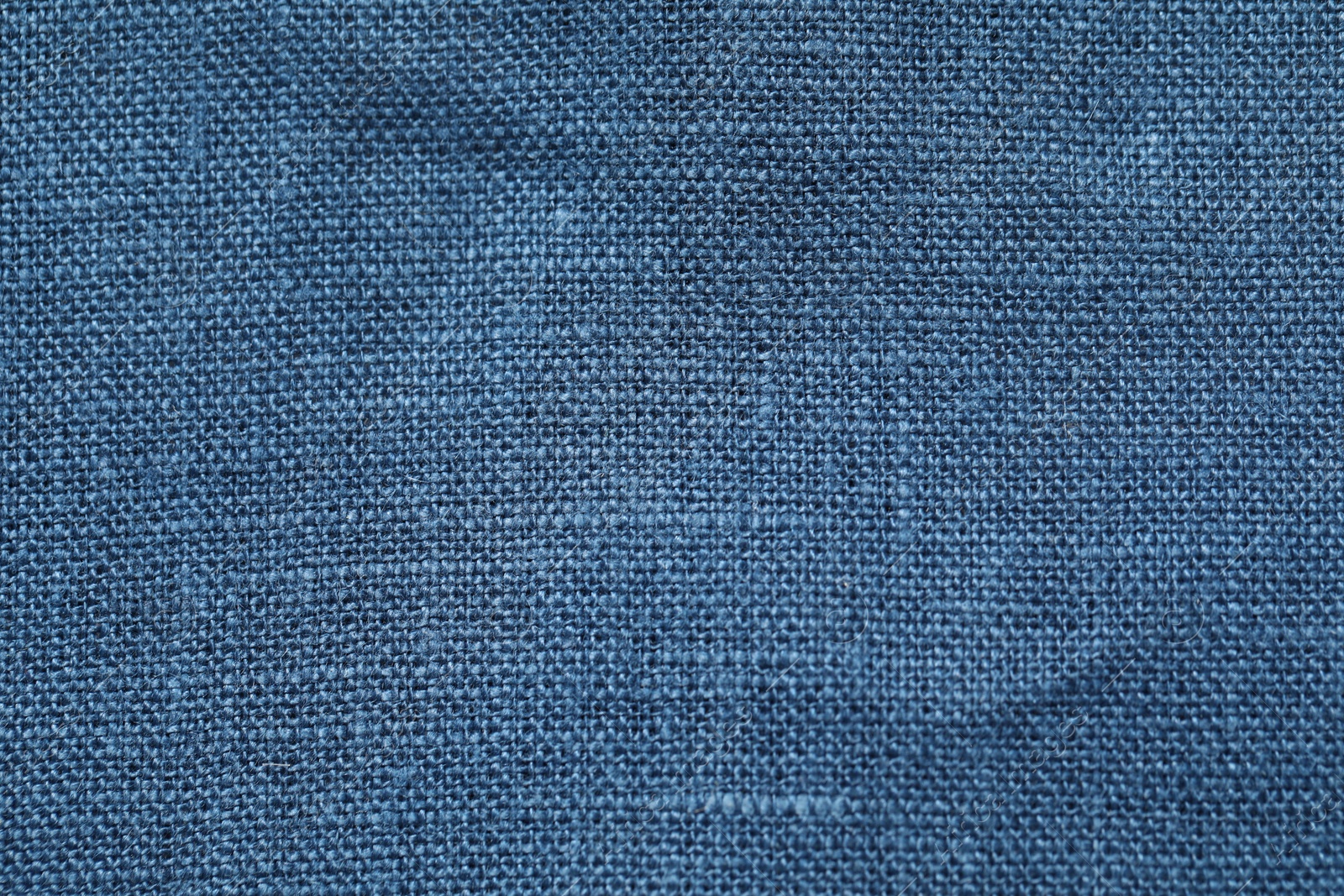 Photo of Texture of blue fabric as background, top view