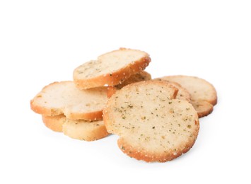 Photo of Heap of crispy rusks with seasoning on white background