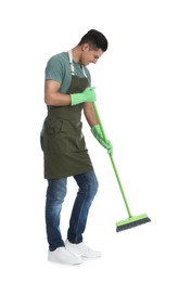 Photo of Man with green broom on white background