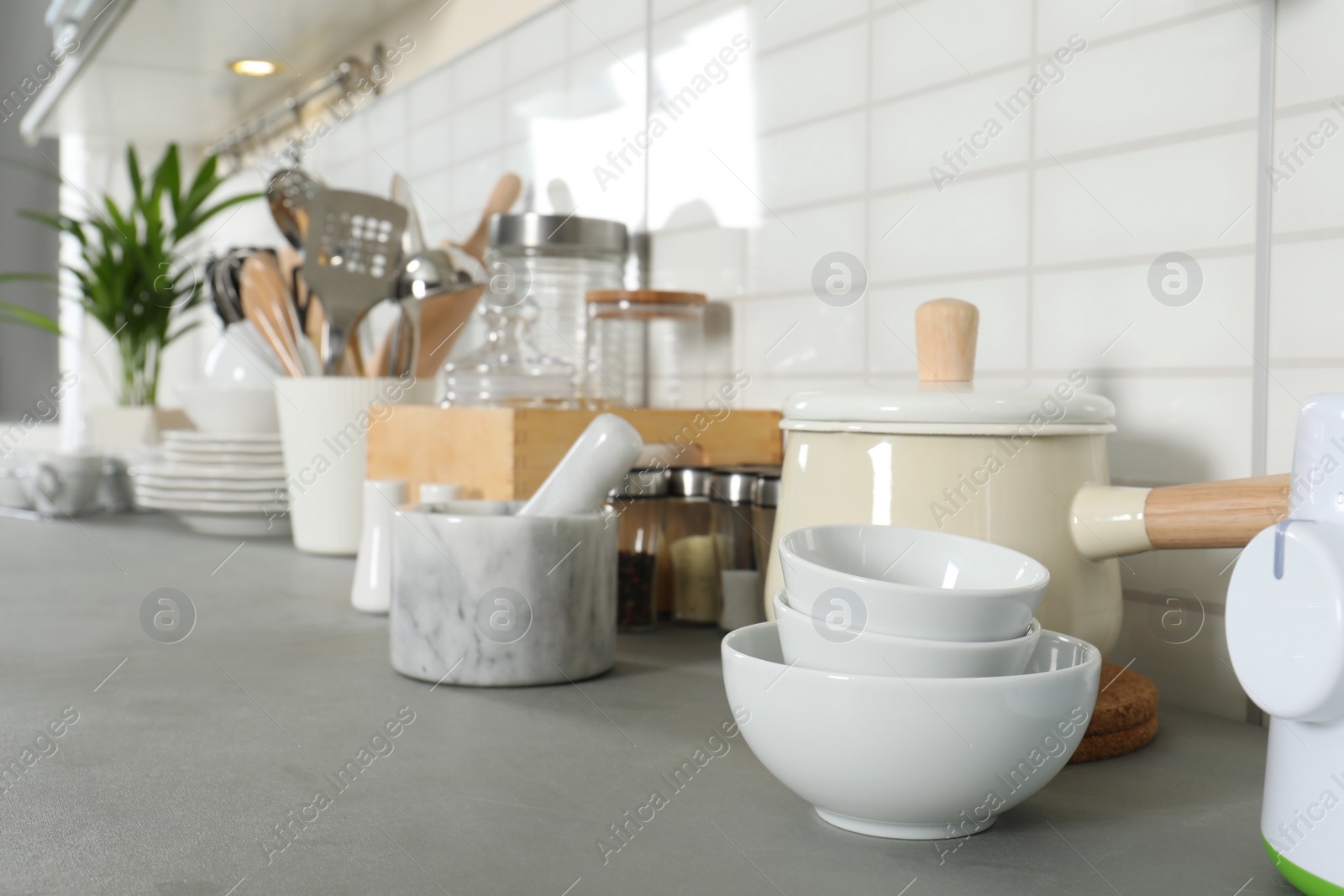 Photo of Clean dishes and utensils on kitchen counter