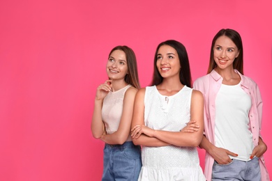 Photo of Happy women on pink background, space for text. Girl power concept