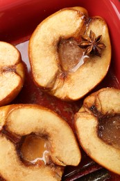 Photo of Tasty baked quinces with anise and honey in dish, top view