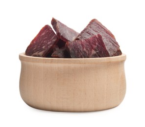 Photo of Delicious beef jerky in wooden bowl isolated on white