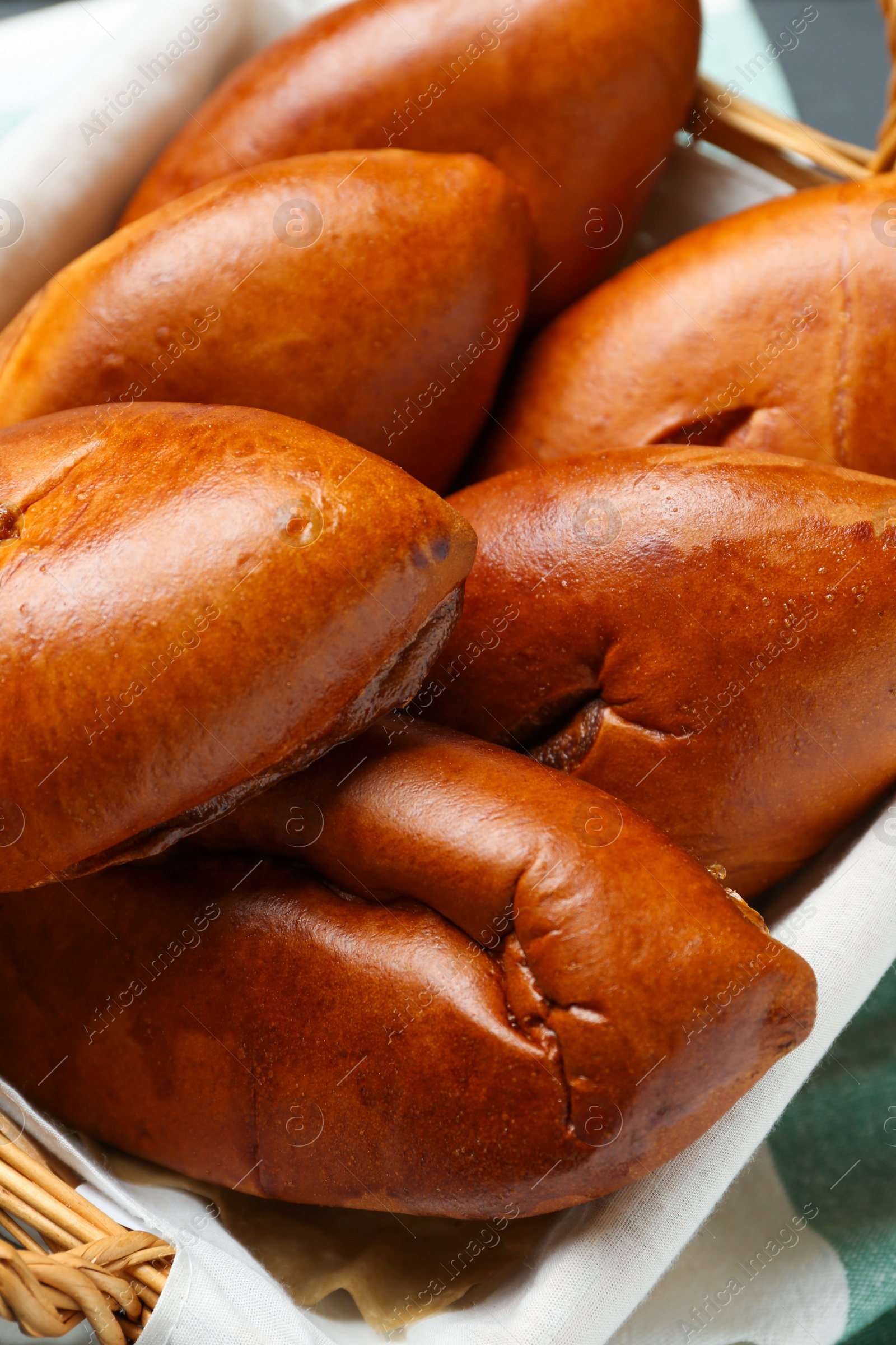 Photo of Many delicious baked patties on table, closeup