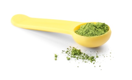 Photo of Spoon with powdered matcha tea on white background
