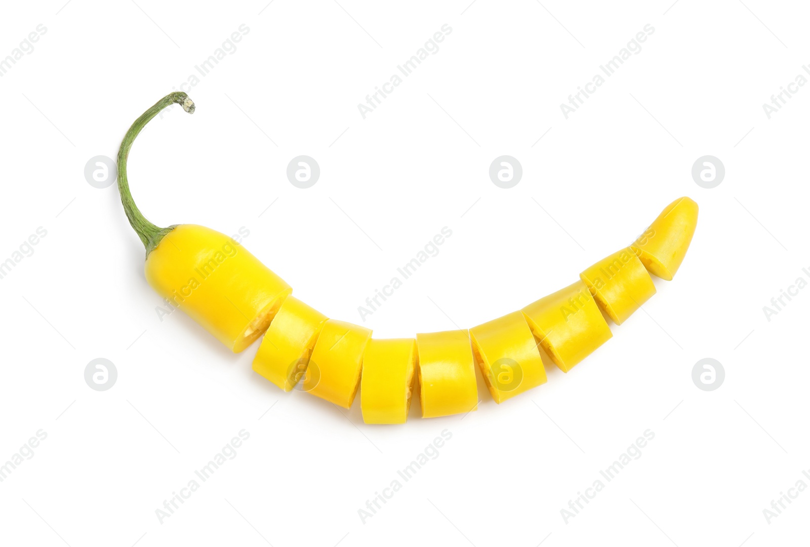 Photo of Cut ripe yellow chili pepper on white background, top view