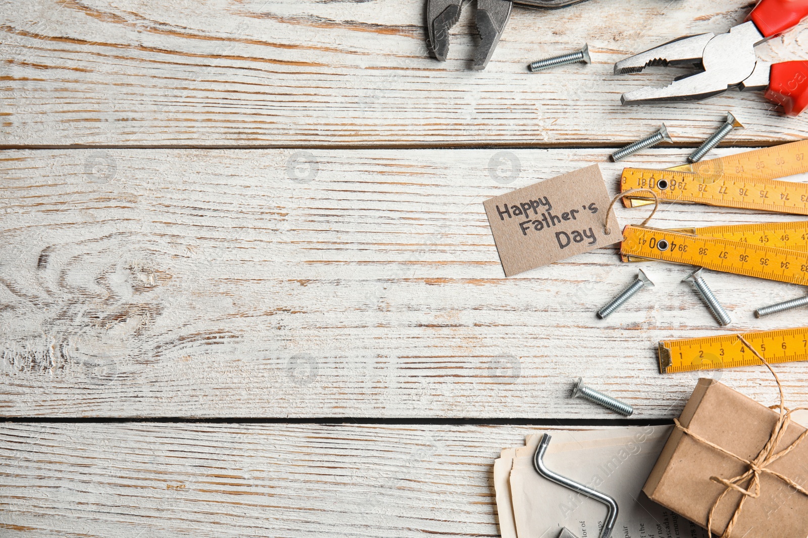 Photo of Flat lay composition with different tools on white wooden background, space for text. Happy Father's Day