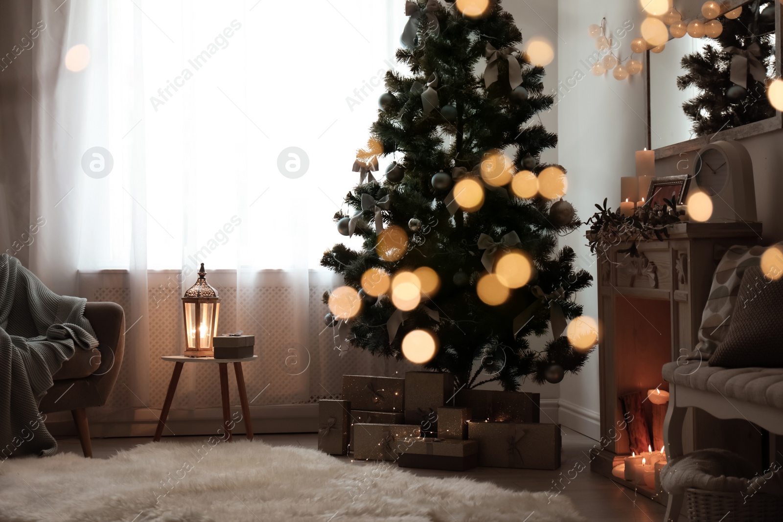 Photo of Stylish living room interior with decorated Christmas tree and blurred lights in foreground