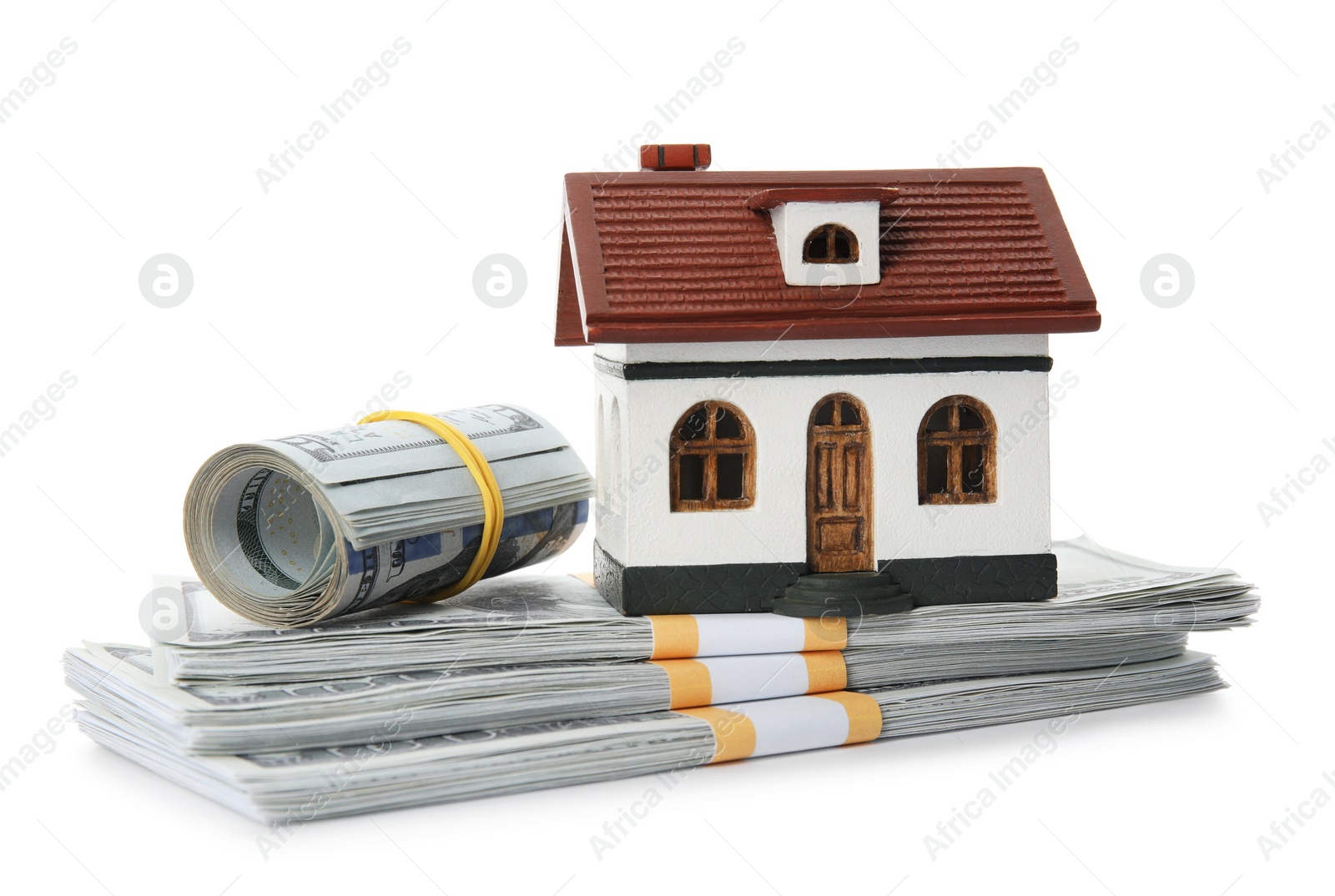 Photo of House model with money on white background