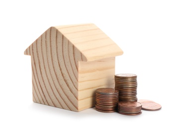 Photo of House model and coins on white background. Money saving concept