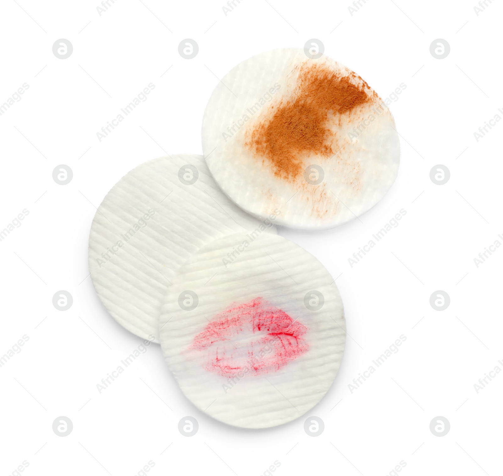 Photo of Clean and dirty cotton pads after removing makeup on white background, flat lay