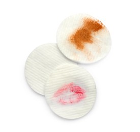 Photo of Clean and dirty cotton pads after removing makeup on white background, flat lay