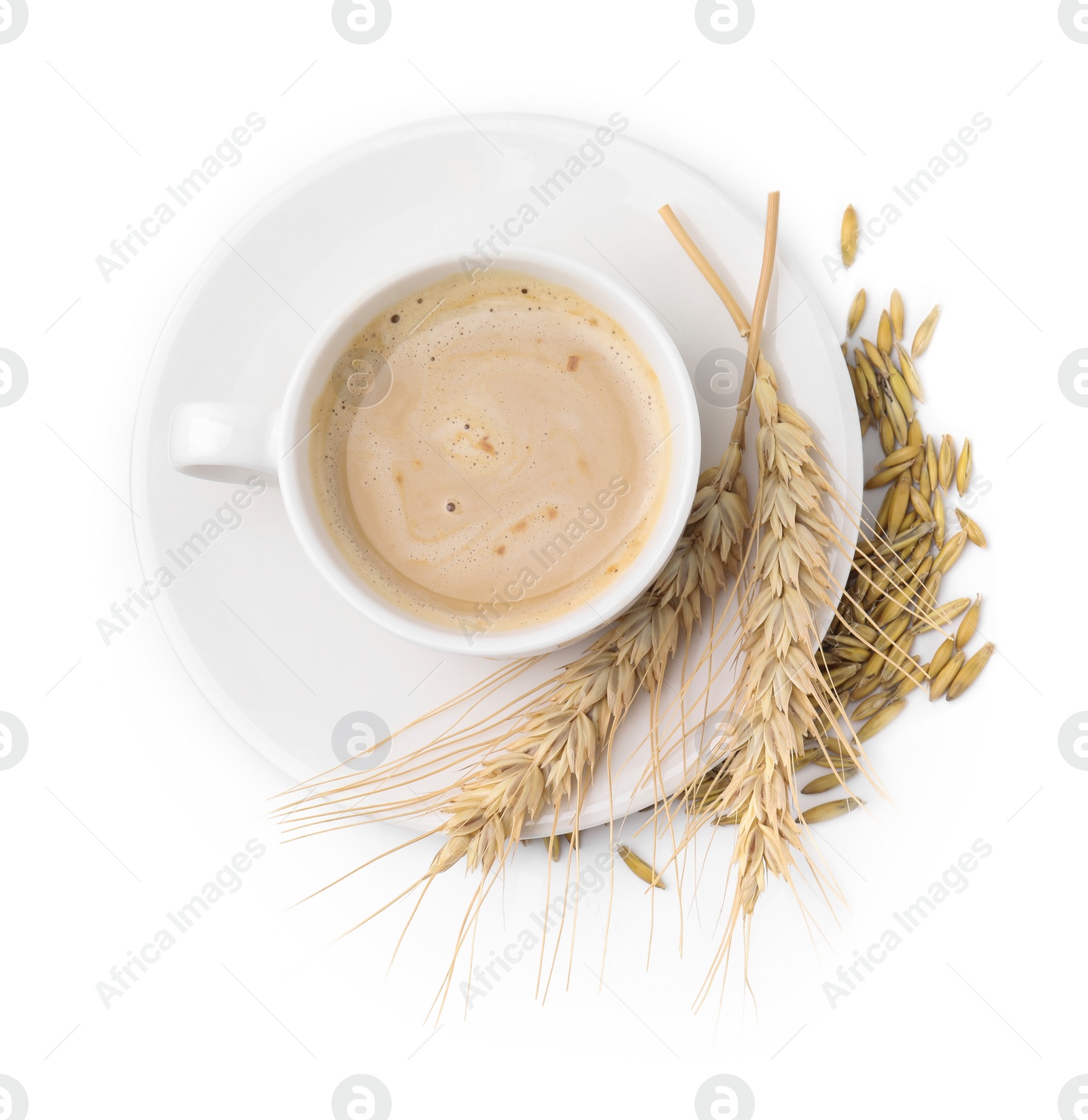 Photo of Cup of barley coffee, grains and spikes isolated on white, top view