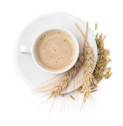 Photo of Cup of barley coffee, grains and spikes isolated on white, top view