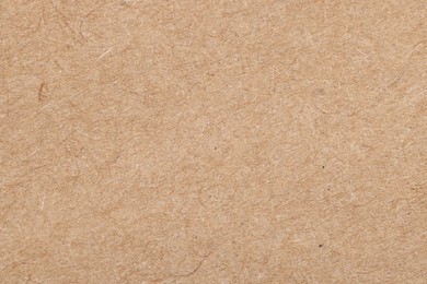 Photo of Texture of beige paper sheet as background, top view