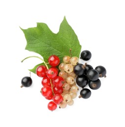 Photo of Fresh red, white and black currants with green leaf isolated on white, top view