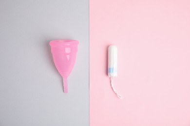 Menstrual cup and tampon on color background, flat lay