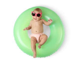 Photo of Cute little baby in sunglasses with inflatable ring on white background, top view