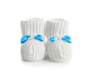 Photo of Handmade baby booties with bows isolated on white