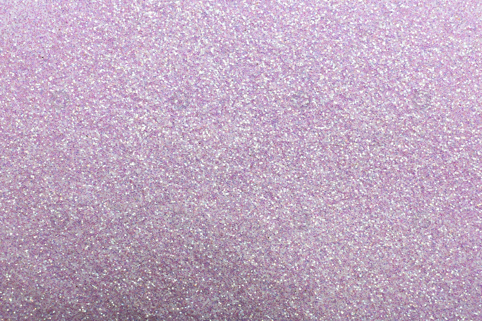 Photo of Closeup view of sparkling pink glitter background