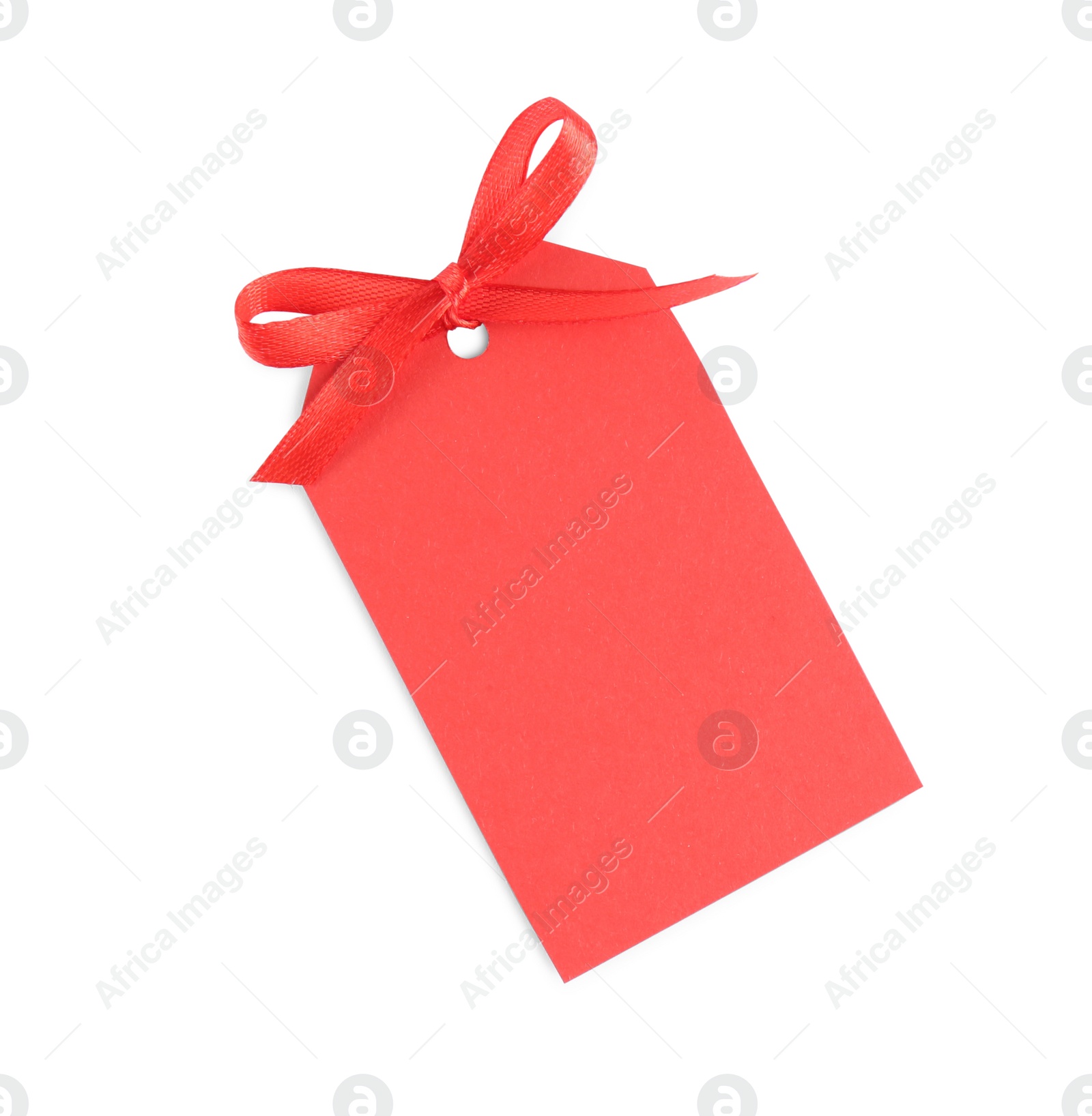 Photo of Blank red gift tag with satin ribbon on white background, top view