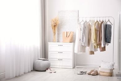 Photo of Dressing room interior with stylish white furniture