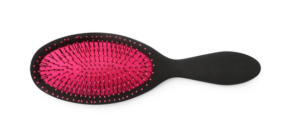 Photo of New plastic hair brush isolated on white, top view