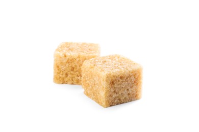 Photo of Two brown sugar cubes isolated on white