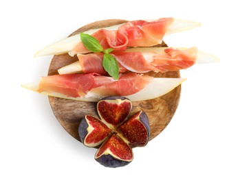 Photo of Wooden board with tasty melon, jamon and figs isolated on white, top view