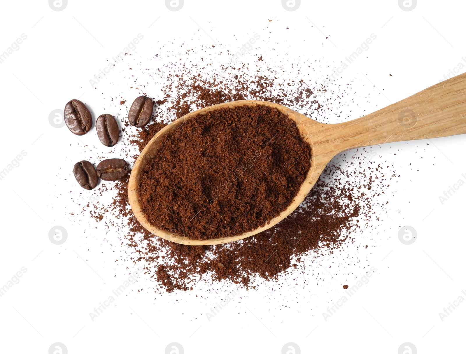 Photo of Wooden spoon of ground coffee and beans on white background, top view